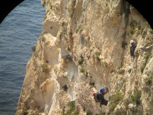 Ben Metzger and Antonio Vilches going down on a rope to discover new Cory's chicks