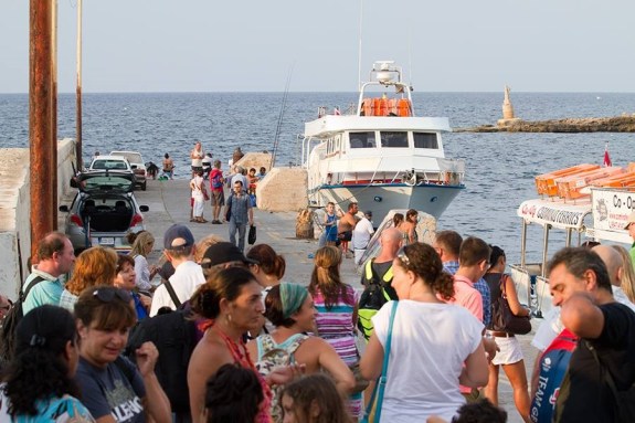 Crowds gather prior to boarding the boat.